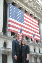Ken Grant and Melanie Hasty-Grant of ­Waterstone Private Wealth Management ­in front of the NYC Stock Exchange.
