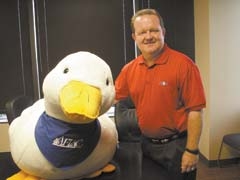 Aflac associate Mike Kirk and Aflac Duck present serious business in a fun way.