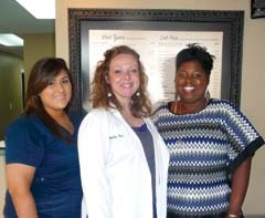 Karolyne Velazquez, Dr. Melita Tate and Cherelle Allen ­welcome patients to Grassroots Healthcare.