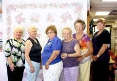 Gamma Pi ESA members with the handmade embroidered quilt to be given away at the Bunco tournament (L to R): Carol Applegate, Gertrude Riddle, Barbara McClure, Janie Stevens, Kay Kirkes and Karla Applegate. The quilt is on display at the Inola Library.