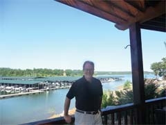Ron Howell, developer of Cross Timbers Marina at Skiatook Lake, on the deck of the Lakeside Grill.