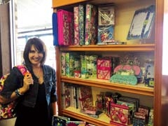 Mandi Bruner, sales and marketing manager of J &amp; J ­Pharmacy and Gifts, with Vera Bradley school supplies.