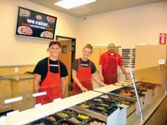 Garrett McKinney, Taylor Bennett, and General Manager James Gaddis of Top That! Pizza in Tulsa Hills Shopping Center.