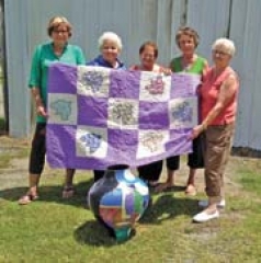 ESA members are preparing for their annual Bunco fundraiser set for August 23. Standing before the handmade donated quilt, which will be given away that night (L to R): Karla Applegate, Carol Applegate, Janie Stevens, Kay Kirkes and Gertrude Riddle.