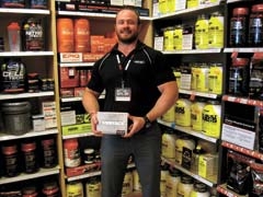 Robb Winn, regional sales manager for Draper Family GNC, seen here with the Draper Family’s best selling weight loss system, Embrace Elite.
