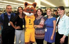 Tulsa Shock Mascot, Volt, poses with Goodwill employees at the grand opening of the new retail store on Southwest Boulevard. (L to R): Joe Davis, Star Barley, Volt, Store Manager Jaime Monroe, Kristin Payne and Michelle MacKool.