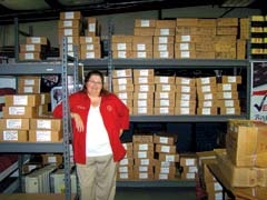 Julie Dermody, secretary of the Rogers County Election Board, with boxes of counted and stored ballots.