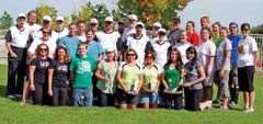 Members of the 2010 Special Olympics Wildcats softball team and their 
coaches (in white shirts), with Amazing Race for Charity committee members and 
team members who ­participated in the event.