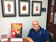 Gary Moeller, department of fine arts, RSU, with this year’s winning 
contest poster by Jordan Wong.