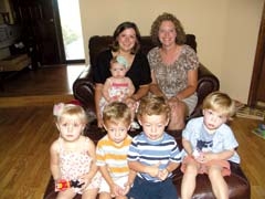 Donna Evins (right) and her children Braden (blue stripes) and Hunter (orange stripes), and Breanna Grove holding Gracyn and with children Ethan and Avery.