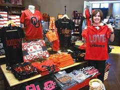 Cathy Haney is excited about the selection of team spirit items available at Surceé.