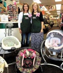Owner Kari Hendrix (right) and employee Kasey with items that won’t stay in stock long –equipment sells fast at Children’s Orchard.