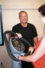 Dr. Day works with a patient at his office at 31st and Harvard.