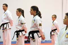 Students of Martial Arts Academy (L to R): Keith Davis, 45, Second Degree Black Belt; Lexi Vincent, 14, Second Degree Black Belt; Samantha Bible, 11, Second Degree Black Belt; and Peyton Mueters, 8, First Degree Black Belt.