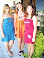 Surceé offers TU, OSU and OU dresses just in time for back to school. (L to R): Surceé employees Kristen Pallett and Courtney Vanlandingham and ­customer Tory Fitch.