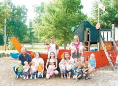 (L to R): Joe Newby and Jennifer Lawson-Newby and their “quads,” Tara and Steve Myrter with their twins, Paula Evans with her twins, Jennifer Quinnelly (standing) with her twins and daughter Taylor, and Martha Vargas and her twins.