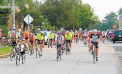 Mass start features riders heading west from Gazebo Park on Main Street in downtown Claremore.