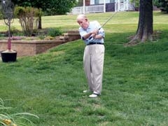 Tony Jacklyn, 94, practices his golf swing weeks after a minimally invasive alternative to back surgery was performed by Dr. Webb.