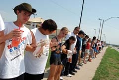 A “Joining of the Hands” at the 3rd annual Rally for Victims.