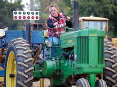 Kathi Turner competes on the fully restored John Deere Model 60 Tractor, purchased new by her grandfather in 1955.