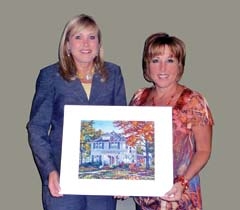 Wine, Eats &amp; Easels coordinators Kelley Rash and Kate Buster hold a piece by artist Stephen Smith, who will return to this year’s event.