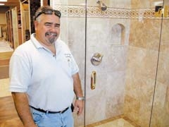 Tony Sementi, owner of Tile by Tony in Catoosa, says many people are investing in remodeling their homes, rather than buying new.