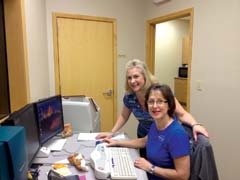 Peggy Trease (standing) and Barbara Ginn, in the room where Barbara examines the 
MRI images and talks the ­patients through the procedure on a microphone.