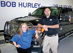 Assistant Accessories Manager Kori Hurley and  “The Accessory Guru” Jeff Leslie with a customer’s new “tricked out” F250 Ford Lariat truck.