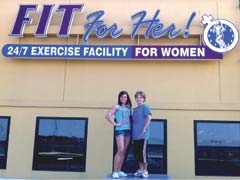 Brittany and Adana Gittelman atop the roof at Fit For Her, overlooking a growing Owasso area.