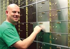 Protect your valuables in a safe deposit box like the ones seen here. Pictured is Matt Klem.