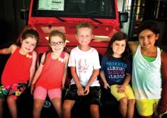 Zip Gordon (center) joined by (L to R) Avery and Addison Clyma (friends), Callie James (cousin), and big sister Arlie Gordon in front of the 2013 Jeep Wrangler that is being raffled.