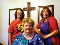 Owner Suzanne Carroll pauses to smile with staff at ­Claremore’s Children Center.