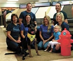 Grigsby’s staff members with Captain, an adoptable pet from the SPCA. (Back row): David Stover, Richard Trim, (Front Row): Leslie Pennington, Amanda Payne, Lindsey Covey, Penny Carnino and Payton.