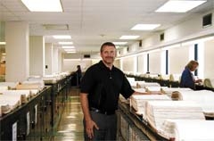 Senior Vice President Heath Spiegel, amongst the expansive records of Guaranty Abstract Company.