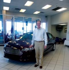 Steve Kissee, president of Jack Kissee Ford, with the all-new 2013 Ford Fusion.