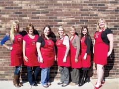 Junior Ocieleta members get their aprons ready for the club’s 29th annual Christmas Home Tour. (L to R): Kristin Roseberry, Eileen Skocdopole, Jessica Wilbourn, Heather Isaacs, Lynsey Simmons, Cheri Peters and Savannah Haddock.