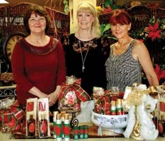 Patsy Terry, owner, Arrow Flowers; S. Darlene Kitt, owner, 
Winter Wonderland; and Linda Toppins, owner, Bella Vita, are ready for the Holiday Tea Off.