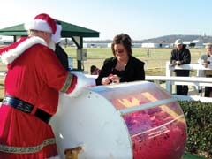 Santa Claus and Santa Cash Committee Chair Julie Simmons will be on hand again this year at Will Rogers Downs ­Grandstands to draw the winning $6,500 grand prize winner, as well as the second place $2,500 prize.