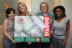 Showing off the 17th annual Buy Broken Arrow 2011 campaign poster (L to R) are ­Broken Arrow Area Chamber of Commerce staff members Jessica Bachelor, ­­­April ­Salisbury, Kathy Reynolds and Dolly Mitchell.