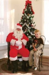 Ron McVicar (as Santa) with Julian Williams during Belvidere Mansion’s Breakfast With Santa event in 2010. (Photo by Salesha Wilken)