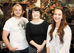 Tabor Smith of The Chasers band, Chairperson Patsy Terry, and singer Delaney Zunwalt look forward to seeing you at the 17th annual Holiday Tea Off, presented by Broken Arrow Main Street Merchants Association.