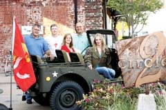 Staff members of the Circle Cinema on a Korean Era military jeep: (L to R): Terry Cearley, Frank Michaels, Marry Donnelly, Rick Ronketty, and Amy Carroll.