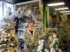 Owner Laura Sanders in the Winter Wonderland display at Surceé.