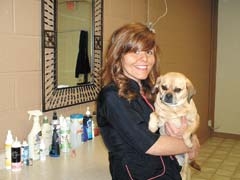 Jackie Lembcke, with her dog Jazz, is a lifetime dog lover and owner of A Cut Above in Broken Arrow.