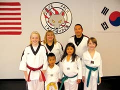 Owners Lisa and Mike Wolfe with students at Wolfe Pack Taekwondo.