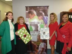 Lara King, Teri Mocha-Newton, Maria Carter and Yani Hopewell make plans for the annual Choices for Life Foster Care Christmas banquet. (Lisa Prescott and Tabitha Holt not pictured.)