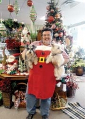 Countryside Flowers owner Steve Baggett with his ­assistants, Buster and Lola. Like any die-hard shopper, Lola\'s head was turned by the beautiful array of gifts and decor.