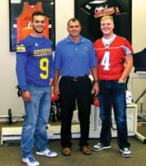 Claremore Sequoyah senior Daniel Moniz, left, and Zane ­McElroy, Collinsville senior, right, credit Summit Physical ­Therapy for helping them to recover from their injuries and ­surgeries to get back on the football field for their senior year. Sean Cox, center, is a registered physical therapist and ­co-owner of Summit Physical Therapy.