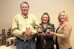 Mark Fuente, president of Spanish Jack’s, ­
Barbara Fuente, vice president, and Melissa 
M. Struttmann of the Creek County Literacy ­Program with products from the fundraising line.