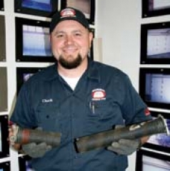 Chuck Billy of Assurance Overhead Doors shows a garage door torsion spring that broke prematurely because it was the wrong spring for the door it was lifting.